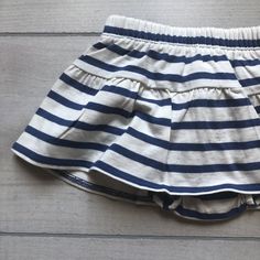 NEW Tea Collection Navy White Striped Skort - Sweet Pea & Teddy White Cotton Bloomers With Elastic Waistband, White Cotton Short Bloomers, Stretch Cotton Skirted Shorts, Cotton Bloomers With Elastic Waistband For Playwear, White Cotton Bloomers For Playwear, Playful Skirted Bottoms With Elastic Waistband, Stretch Cotton Bloomers With Elastic Waistband, Spring Playwear Diaper Cover, Short, White Casual Diaper Cover For Playwear