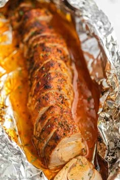 pork loin wrapped in foil with sauce