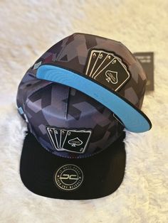 Add a pop of color to your casual outfits with this 100% original JC HATS snapback. Crafted from soft cotton, this blue camouflaged hat is perfect for men of all sizes. With an adjustable strap, it can be customized to fit your head comfortably. Ideal for any occasion, this colorful hat features the iconic JC brand logo on the front. Made in China, this hat is perfect for men who want to showcase their style. Get ready to turn heads with this stylish snapback from JC HATS. Custom Fitted Hats, Swag Hats, Girl Hats, Colorful Hat, Hats Snapback, Girl With Hat, Fitted Hats, Hat Designs, Baby Hats