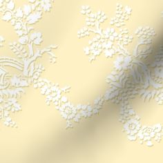 a yellow and white wallpaper with an intricate design on it's side, next to a ruler