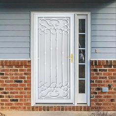 a white front door on a brick house