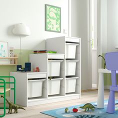 a child's playroom with toys and bookshelves