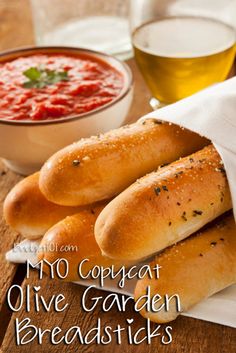 breadsticks with marinara sauce and basil on the side