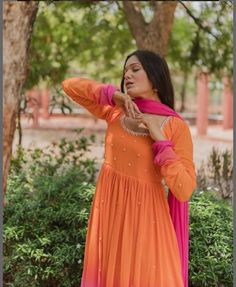 Hand embroidered Anarkali with embroidery  dupatta / orange pink anarkali suit set / anarkali dupatta USA / georgette dress with embroidered scallop dupatta / Indian dresses/ voggish / orange maxi dress         Looking for a perfect indian dress/anarkali/suit sets that are trendy, unique and easy to carry !! yess, You are at the right place. we carry such versatile pieces of anarkalis and suit sets that really let you stand out in any occassion !!      featuring this beautiful georgette dress in ombré shade of orange and pink color with hand embroidered at the front neck and body with full gathered sleeves as shown paired with matching soft georgette pink dupatta with lace finish as shown !! A very classy, beautiful look makes your occasion Perfect !! Ready to ship !! can be customized in Anarkali Kurta With Sheer Dupatta In Peach, Peach Anarkali Kurta With Sheer Dupatta, Peach Semi-stitched Anarkali Set, Unstitched Orange Anarkali Set With Gota Work, Designer Orange Georgette Anarkali Set, Designer Orange Anarkali Set With Mirror Work, Orange Georgette Anarkali Set, Peach Anarkali Set For Designer Wear, Peach Anarkali Kurta