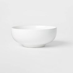 a white bowl sitting on top of a table