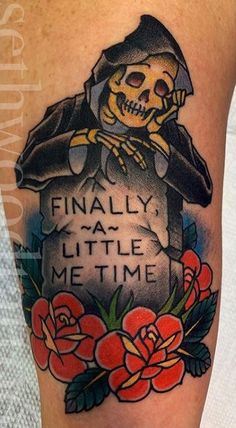 a tattoo on the leg of a person with a skull and roses around it, that says finally my little me time