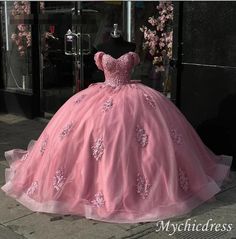 Crafted with a glitter ball gown and adorned with an elegant off-the-shoulder design, this stunning Quinceanera dress is perfect for your special occasion. The bow detail adds a touch of sophistication, while the flowing skirt guarantees a graceful entrance. Be the center of attention in this pink princess gown. Catalo Quinceanera Ball Gown With Sweetheart Neckline For Prom Season, Sweetheart Neckline Ball Gown For Quinceanera And Prom, Sweetheart Neckline Ball Gown For Sweet 16 And Prom, Quinceanera Ball Gown For Prom Season, Floor-length Quinceanera Dress For Sweet 16 During Prom Season, Prom Season Ball Gown For Sweet 16, Sweet 16 Ball Gown Evening Dress For Prom Season, Sweet 16 Ball Gown For Prom Season, Elegant Tulle Gown For Sweet 16