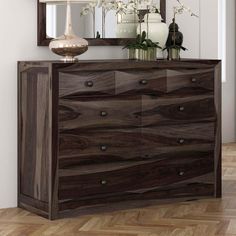 a large wooden dresser sitting on top of a hard wood floor