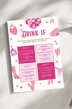 a pink drink if poster on top of a table