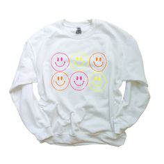 🛒This trendy and comfortable Smiling Face Neon Crewneck Sweatshirt is a great way to express yourself. Wear it as an everyday look or when you want to feel extra happy. It features a preppy, casual design smile design, a crewneck, and smiling faces in neon colors. Super soft, cozy and comfy this oversized sweater is a definite MUST HAVE! 📦 FREE SHIPPING on orders $35 or more to US shoppers 👕Brand = Gildan 🧵Fabric = 50% Cotton / 50% Polyester ✂️Design = Heat-applied neon yellow, neon pink and Cheap Fun T-shirt With Smiley Face, Cute Sweatshirt Designs, Neon Smiley Face, Neon Sweatshirt, Trendy Crewneck Sweatshirt, Smiley Face Sweatshirt, Clothes Preppy, Preppy Sweatshirts, Orange Vinyl