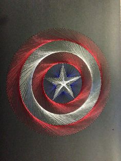 a red, white and blue circular object with a star in it's center