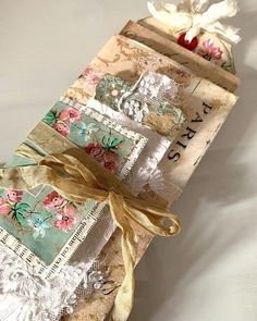 three pieces of fabric wrapped in different patterns and colors with ribbons tied around the edges