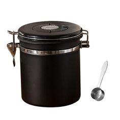 a large black container with two spoons on the side