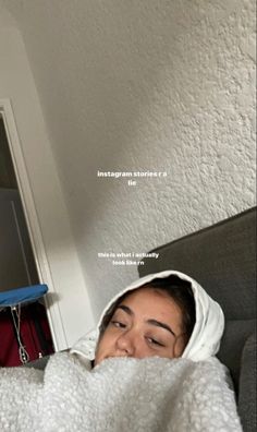 a woman laying in bed under a blanket with her eyes closed and the words instagram stories written on it