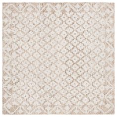 a beige and white rug with an intricate design