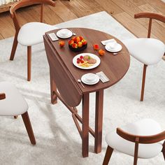 a table with plates and bowls of food on it in the middle of a room