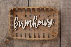 a basket with the word farmhouse on it