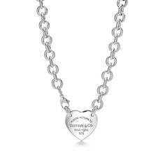 Inspired by the iconic key ring first introduced in 1969, the Return to Tiffany collection is a classic reinvented. The simple heart design of this necklace makes a bold style statement. Sterling silver; Tag, size extra large; Necklace, 15.5" long | Return To Tiffany® Heart Tag Necklace in Sterling Silver, 155" Tiffany Heart Tag Necklace, Tiffany Key Ring, Simple Heart Design, Heart Toggle Necklace, Tiffany And Co Jewelry, Return To Tiffany, Tiffany Necklace, Large Necklace, International Jewelry