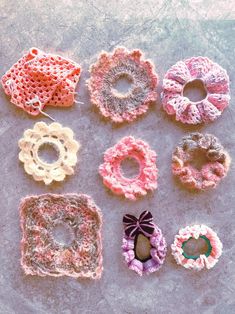 several crocheted items are arranged on the floor