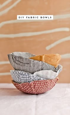 four fabric bowls stacked on top of each other with the words diy fabric bowls above them