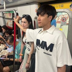 a group of people riding on a subway train