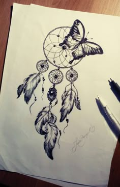 a drawing of a dream catcher with butterflies on it