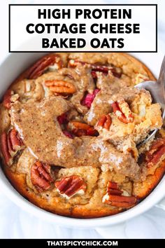 high protein cottage cheese baked oats in a white bowl with pecans on top