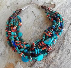 The Santo Domingo necklace is made with 6 Strands of Natural Kingman turquoise, Mediterranean coral, Orange Spiny Oyster shell, Lapis, Onyx, Purple spiny oyster shell and olive shell Heishi beads towards the sterling silver cone ends. The necklace is 17” in length with a 2” extension to be worn longer if needed. The necklace was made by an accomplished and talented Santo Domingo Artist Daniel Coriz son of Nestoria and Valentino Coriz and Grandson to the Late Lupe Pena. Lupe Pena and Nestoria Cor Tortoise Jewelry, Antique Turquoise Jewelry, Olive Shell, Gem Stone Necklace, Treasure Necklace, Statement Wedding Jewelry, Beaded Projects, Beautiful Beaded Jewelry, Turquoise Gold Ring