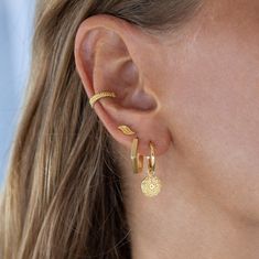 "Our handmade gold wave stud earrings! These beautiful and dainty wave-shaped earrings are perfect for those who love the beach and the ocean. The minimalist design makes them perfect for everyday wear, and the small size makes them great for second hole earrings or for those who prefer smaller earrings.  These wave stud earrings are a must-have for anyone who loves surfer jewelry or beach accessories. These gold wave earrings make the perfect birthday or Mother's Day gift for any woman who loves surf culture and the ocean. These earrings are handcrafted with love and care, making them a unique and special gift for any occasion. Our wave stud earrings are made with 18k gold-plated brass, ensuring they are skin-friendly and long-lasting. The beautiful and intricate design of the waves is pe Gold Plated Earrings As Summer Gift, Gold Plated Earrings For Summer Gift, Summer Gift Yellow Gold Earrings, Trendy Gold Hoop Earrings For Beach, Yellow Gold Pierced Earrings For Beach, Yellow Gold Beach Earrings, Second Hole Earrings, Wave Earrings, Surfer Jewelry