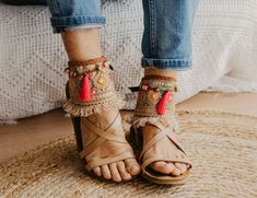 These Boho Sandals ankle belts will help you to completely transform any basic sandal into something stylish and unique. They are made with carefully selected ethnic materials, in a completely handmade process. With them, you will get those sandals that you wear everywhere and have super comfortable, have a different air when you want. In this way, you can enhance that Boho-Chic style that we love so much. This ad is for a pair of anklets, footwear is not included. If you need a custom design or for a girl, do not hesitate to write to me and we will design it together. The anklets are adjustable to fit a variety of widths. Handmade design Made with old trimmings from India, there are only 5 units available Adjustable leather straps Measurements for decorative part of the anklet are approx: Hippie Ankle Wrap Anklets For Festival, Bohemian Ankle Wrap Anklets For Festivals, Bohemian Barefoot Sandals With Ankle Strap For Festival, Bohemian Ankle Strap Barefoot Sandals For Festival, Handmade Festival Anklets With Ankle Strap, Festival Handmade Anklets, Adjustable Bohemian Barefoot Sandals With Ankle Strap, Bohemian Barefoot Sandals With Ankle Wrap, Handmade Bohemian Barefoot Sandals For Beach Season