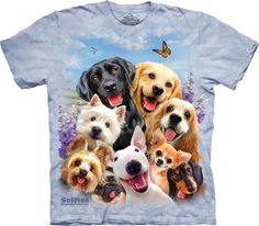 a group of dogs on a blue tie dye t - shirt with butterflies and flowers in the background