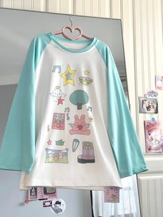 Step into a world of cuteness with our adorable comic-style print top! This charming piece features delightful prints of stars, bunnies, and other whimsical motifs, making it a perfect choice for those who love kawaii fashion. The playful designs add a touch of fun and personality to your outfit, ensuring you stand out in any crowd. Add this adorable piece to your wardrobe and embrace your love for all things cute and playful!  Please note that the price includes only the top.  SizeSMLength6870B Harajuku Style Tops With Funny Print For Spring, White Harajuku Top With Funny Print, Trendy Long Sleeve T-shirt With Cartoon Print, Fun Cartoon Print Tops For Spring, Fun Cartoon Print Crew Neck Top, Spring Fun Tops With Cartoon Print, Cotton Harajuku T-shirt With Cartoon Print, Fun Cartoon Print Spring Tops, Harajuku Style Cotton Cartoon Print T-shirt