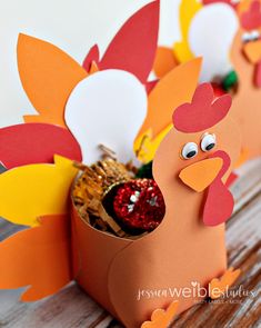 some paper turkeys are sitting on a table