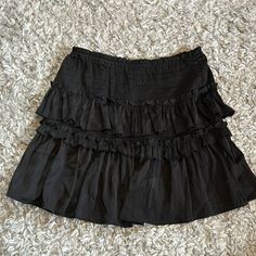 Brand New And Never Worn Black Skirt! Frilly Black Skirt, Whimsigoth Mini Skirt, Black Frilly Skirt, Trendy Black Ruffled Mini Skirt, Black Pleated Skort For Day Out, Casual Black Skort With Ruffles, Black Relaxed Mini Skirt For Summer, Trendy Black Tiered Mini Skirt, Trendy Black Mini Skirt With Ruffles