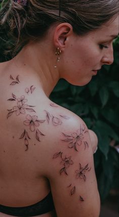 a woman with a tattoo on her back