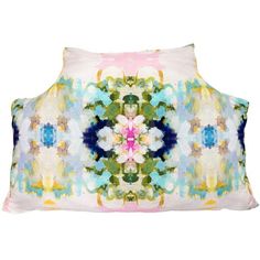 a pillow with an abstract design on the front and back cover in pink, blue, yellow