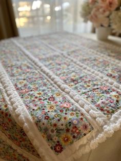 a white table cloth with flowers on it