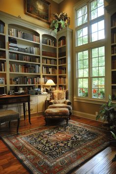 a living room filled with lots of furniture and bookshelves next to a window