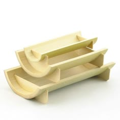 three wooden trays sitting on top of each other