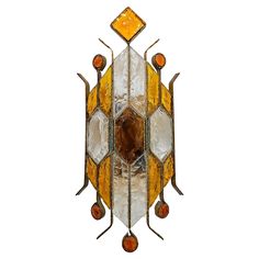 an art nouveau stained glass and metal wall hanging