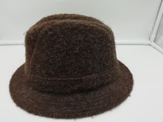 JACOB WOOL MENS HAT BROWN HERRINGBONE TWEED SIZE Xl  Woven in Wales From Jacob Wool Pure British Wool Made in  Holywell Textile Mills Limited high quality wool HOLYWELL TEXTILE MILL :  The Mill was located next to St Winefride's Well and like many factories it used the spring water in the manufacturing process. The factory produced many high quality woollen products including tweed jackets, tapestries and blankets made from Jacob wool. In the First and Second World Wars the factory produced unif Classic Brown Wool Cloche Hat, Brown Tweed Hats With Herringbone Pattern, Vintage Wool Brimmed Cloche Hat, Brown Wool Six-panel Hat, Vintage Wool Flat Cap, Textile Mill, Tweed Jackets, Mens Hat, Shop Buildings