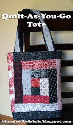 a quilted tote bag sitting on top of a wooden chair next to a wall