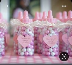 pink and white candy jars with hearts in them