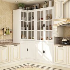 a large kitchen with white cabinets and marble counter tops, along with an area rug on the floor