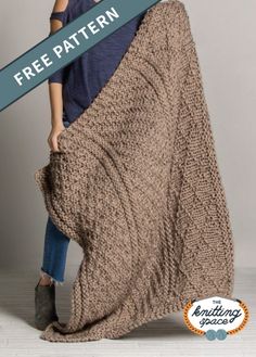 a woman is holding up a knitted blanket with the words free pattern on it