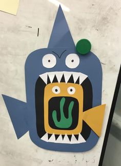 a paper cut out of a monster with its mouth open