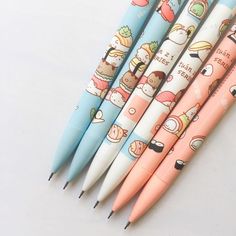 four pens with cartoon characters on them sitting next to each other