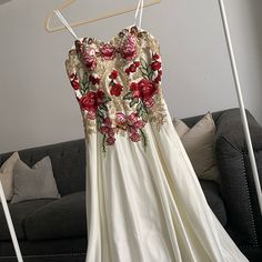 This Beautiful Sleeveless Gown Is Brand New With Original Tag. Layered Floor Length Satin Gown With Gold And Floral Embellishments. Features A Criss Cross Lace Up In The Back. Message Me For Any Questions! White Prom Gown With Floral Embroidery, White Floral Embroidered Prom Gown, White Floral Embroidery Prom Gown, Sleeveless Gown With Floral Applique For Prom, Sleeveless Lace Gown With Floral Applique, Sleeveless Prom Gown With Floral Applique, Sleeveless Floral Applique Prom Gown, Sleeveless Evening Dress With Floral Embroidery, Sleeveless Floral Embroidered Dresses For Debutante Ball