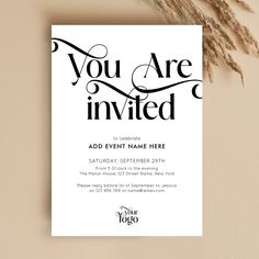 a white and black wedding card with the words you are in - written on it