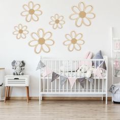 a baby's room decorated in pink and white